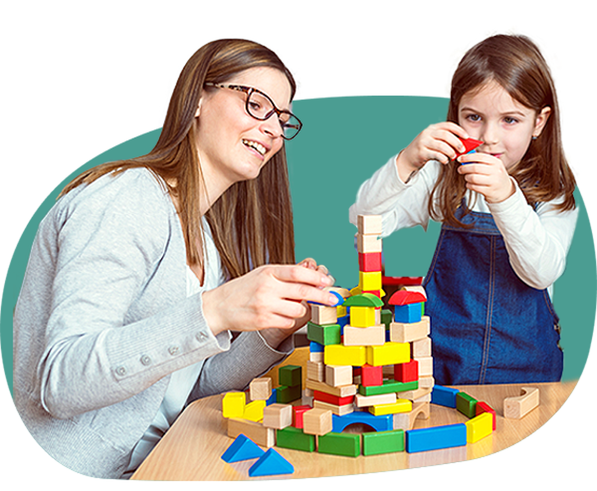therapist helping child with blocks